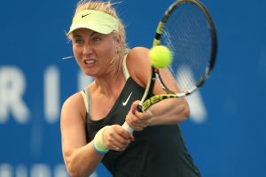 HOBART, AUSTRALIA - JANUARY 04:  Sacha Jones of Australia plays a backhand in her qualifying singles match with Stephanie Bengson of Australia during day one of the Hobart International at Domain Tennis Centre on January 4, 2013 in Hobart, Australia.  (Photo by Mark Metcalfe/Getty Images)