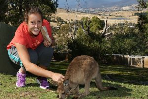 HOBART, AUSTRALIA - JANUARY 05:  Laura Robson of Great Britain feeds a joey on a visit to Bonorong Wildlife Sanctuary during day two of the Hobart International at Domain Tennis Centre on January 5, 2013 in Hobart, Australia.  (Photo by Mark Metcalfe/Getty Images)