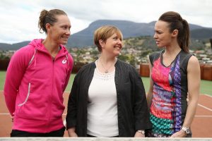Australian number one Sam Stosur and Tasmanian Premier Lara Giddings enjoy hearing about tennis legend Martina Hingis's experiences while on a tour of the MONA Gallery in Hobart.