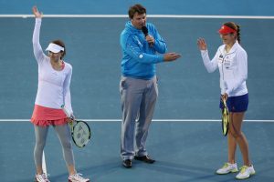 Martina Hingis and Belinda Bencic, with Hobart International tournament director Mark Handley, thank the crowd after tonight's exhibition match. Picture: Getty Images
