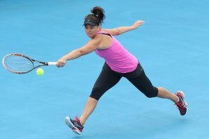 Australian wildcard Casey Dellacqua stretches for a shot during her win against Belgium's Alison Van Uytvanck. Picture: Getty Images
