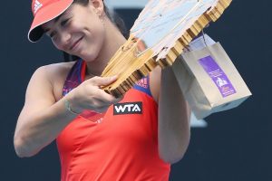 Garbine Muguruza couldn't wipe the smile of her face during the trophy presentation. Picture: Getty Images