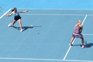 Monica Niculescu plays a forehand as partner Klara Zakopalova watches from mid-court. Picture: Getty Images