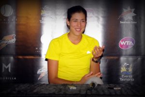 Into a career-first singles final, Garbine Muguruza can't wipe the smile off her face in press. Picture: Casey Gardner