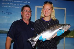 Kristina Mladenovic, the world no.54, is all smiles as she poses with a Tasmanian salmon. Picture: Casey Gardner