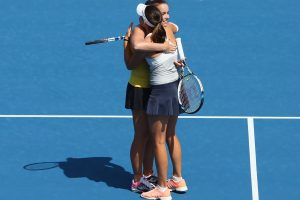 Aussie pair Jarmila Wolfe and Kimberly Birrell embrace after winning their first round. It was Birrell's first WTA Tour main draw level victory. Picture: Getty Images
