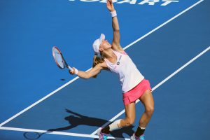 Swede Johanna Larsson serves during her doubles quarterfinal this afternoon. Picture: Kaytie Olsen