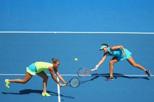 Kateryna Bondarenko and Tatjana Maria stretch for a ball during round one doubles action. Picture: Getty Images