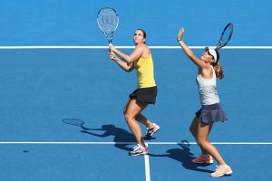 Jarmila Wolfe and Kimberly Birrell both line up a smash. Picture: Getty Images