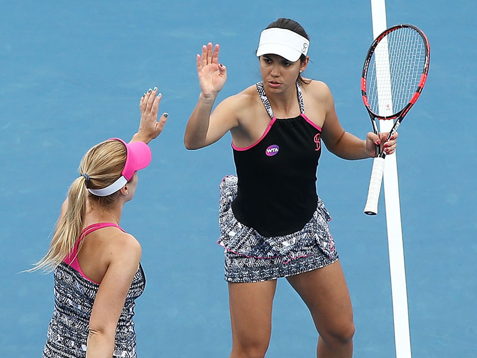 GOOD JOB PARTNER:  Raluca Olaru and Olga Savchuk celebrate their upset win over second seeds Kiki Bertens and Johanna Larsson, snapping their 16-match winning streak that included four titles; Getty Images