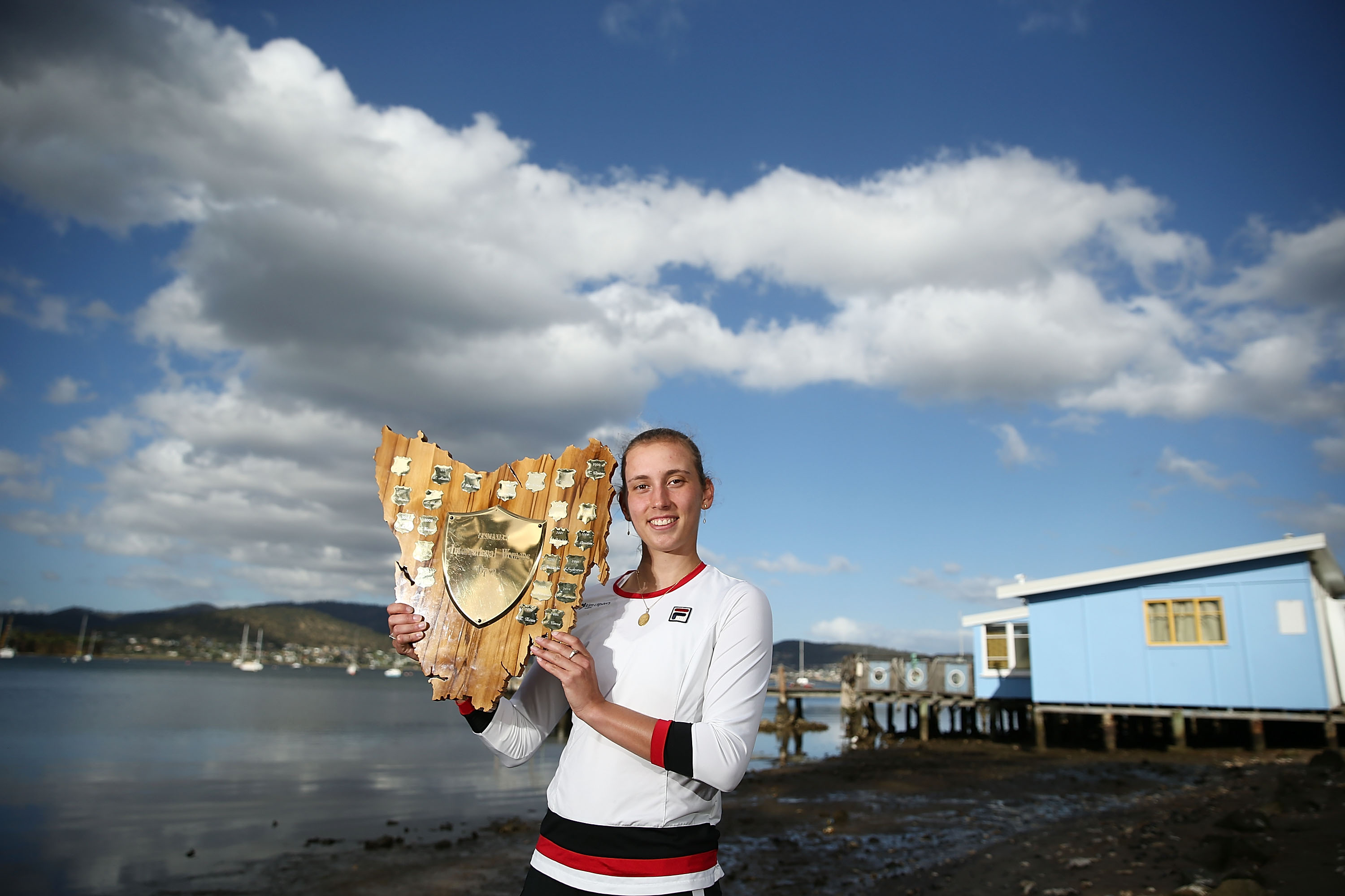 CHAMPION SHOT:  Elise Mertens poses with the winners trophy at Cornelian Bay after her stunning 2017 victory; Getty Images