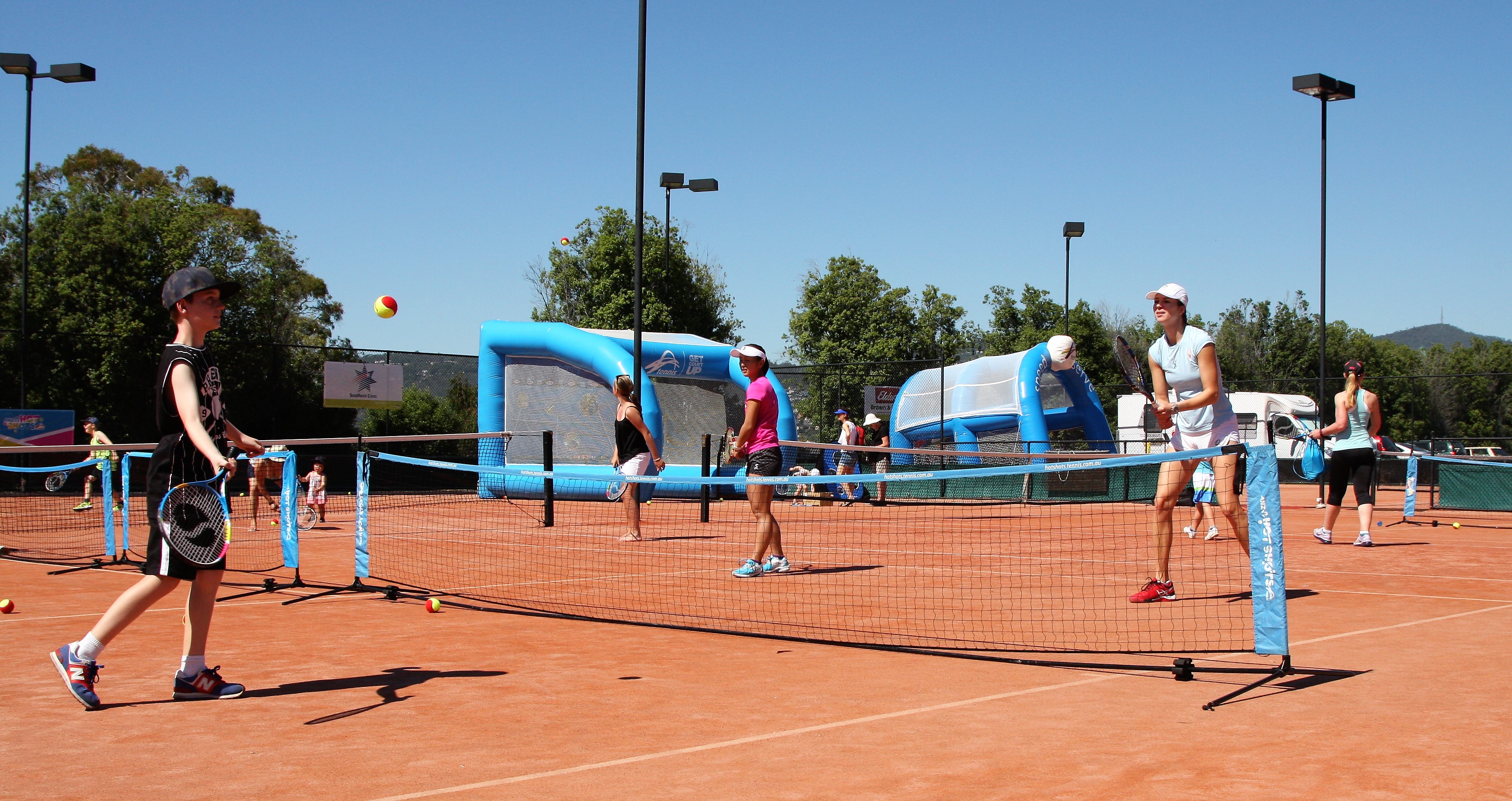 HAVING FUN: Misaki Doi and Galina Voskoboeva joined in the Kids Tennis Day action.