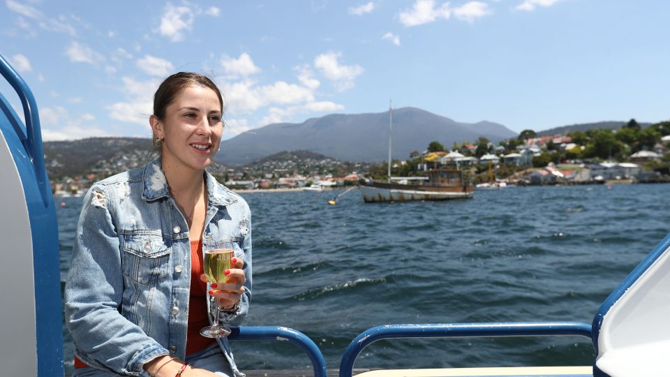 EXPLORING: Belinda Bencic enjoys some sparkling Tasmanian apple juice on the Hobart harbour; Getty Images