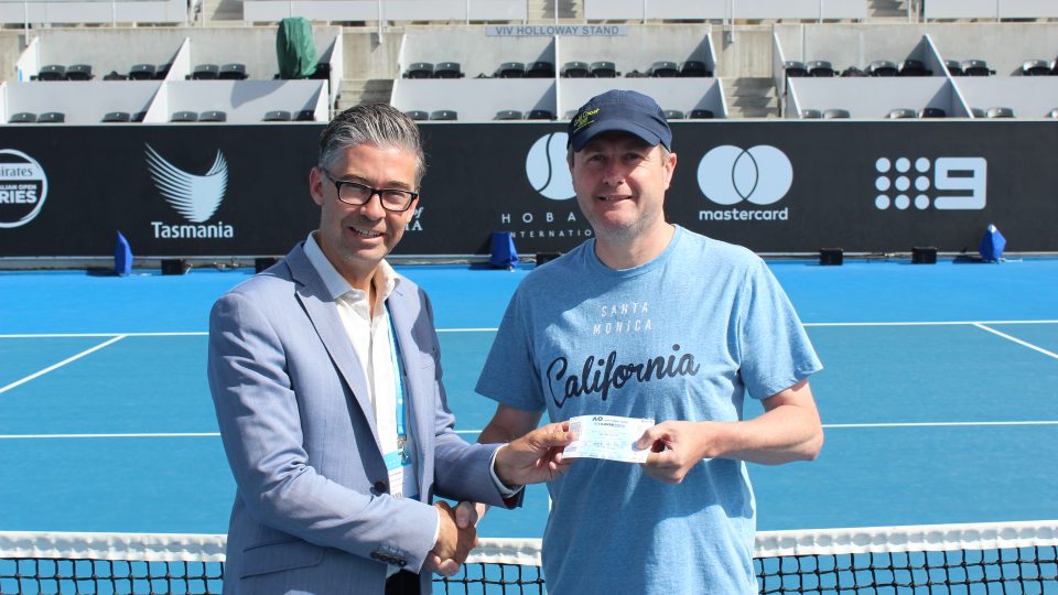 WINNER: Hobart International Tournament Director Darren Sturgess with competition winner Stuart Geeves. Picture: Joe Turmine