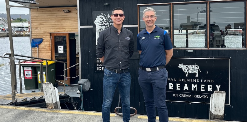 2 men standing in front of Van Diemens Land Creamery